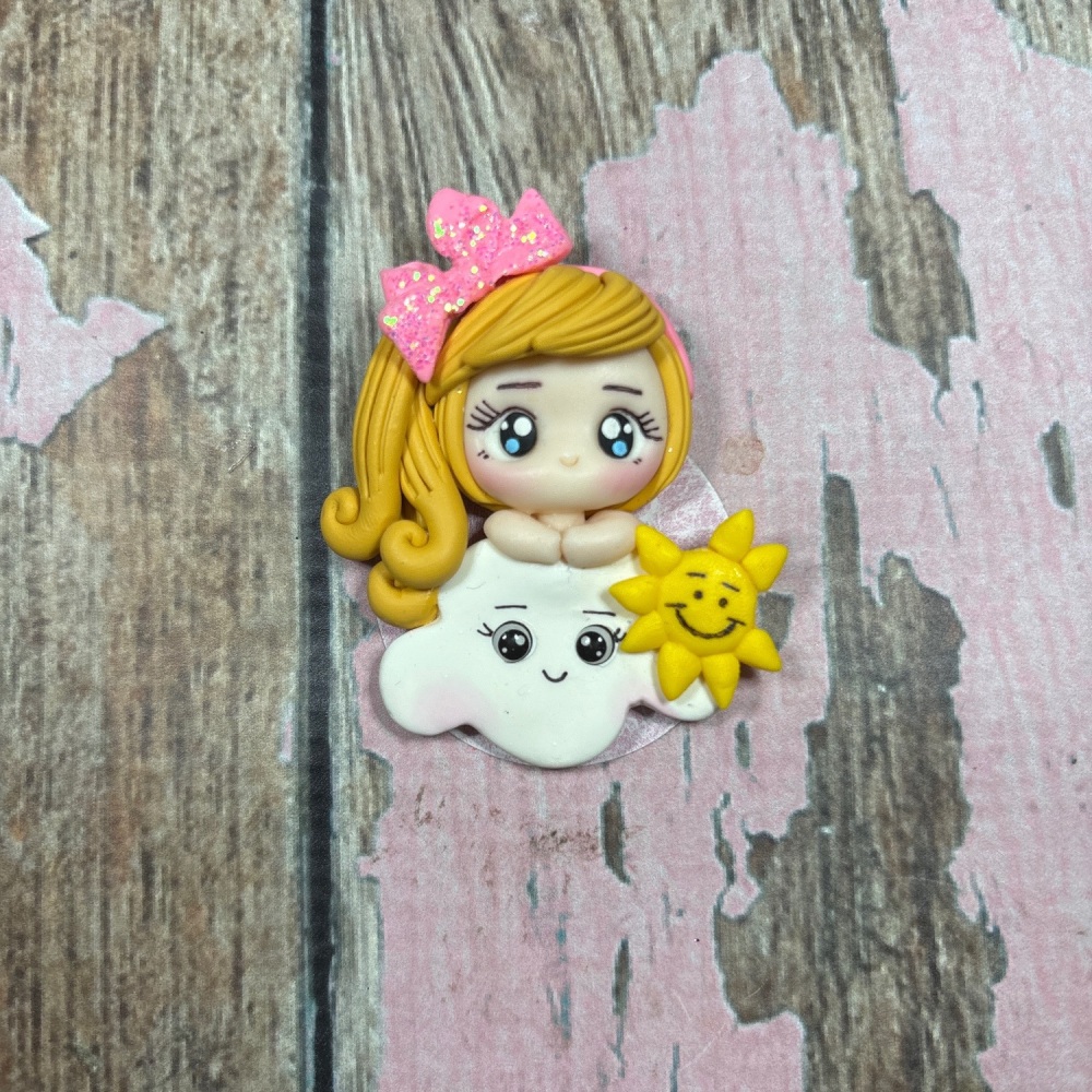 Little Girl with blonde hair with a pink bow on a cloud
