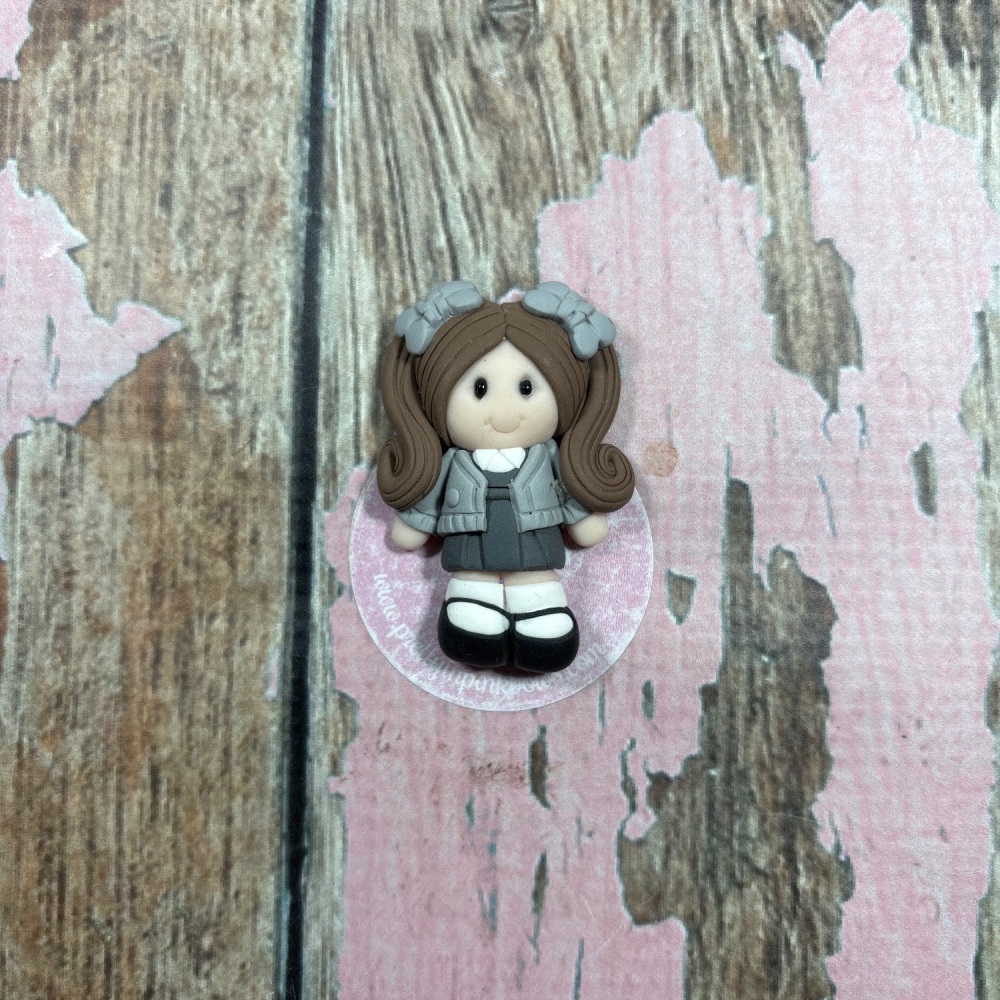 Little girl in grey School uniform grey hair Bows brown hair