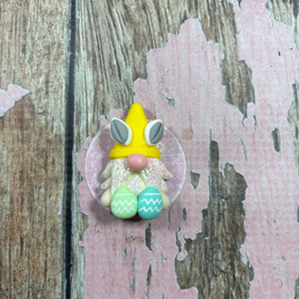 Little Gnome with a yellow hat and Easter eggs