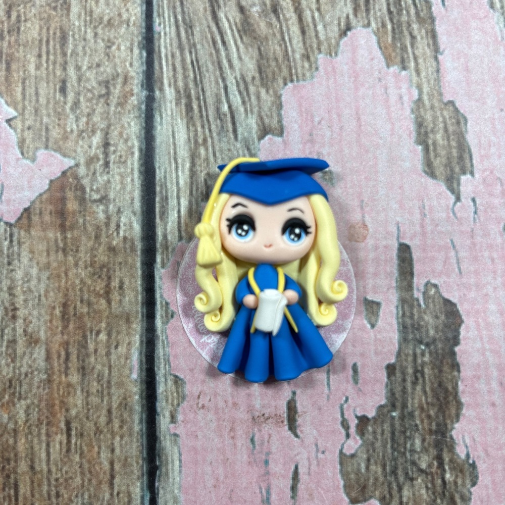 Little Girl with blonde hair in a blue graduation outfit