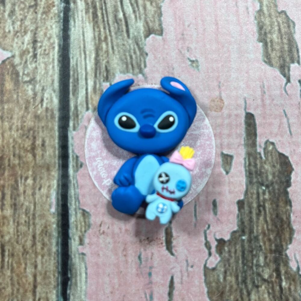 Little Stitch with a small plushie