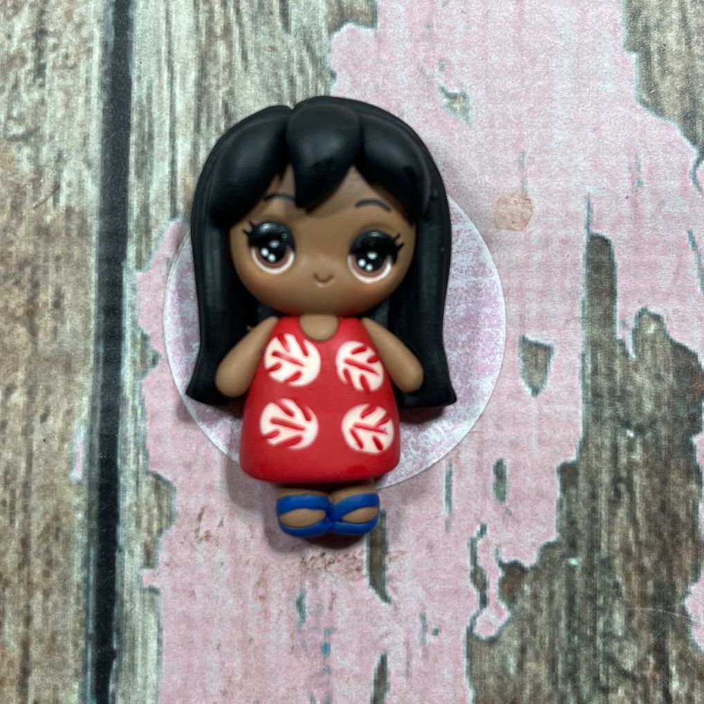 Little Lilo in a red dress with a white leaf pattern