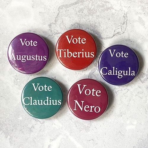Five badges in various colours with the names of the Julio-Claudian Emperor