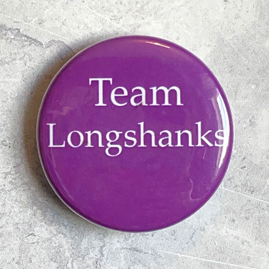 A round purple badge with 