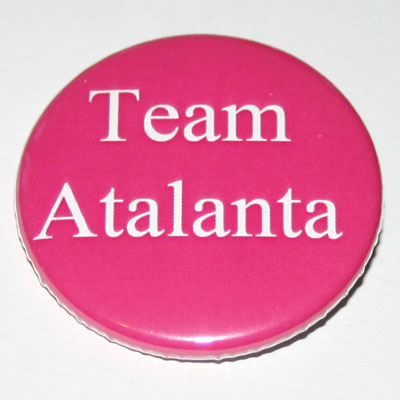 A round pink badge with 