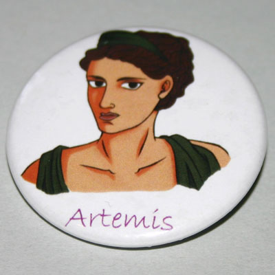 A round white badge with an original artwork of Artemis and her name in pur