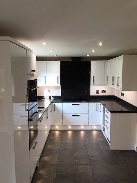 modern white gloss kitchen black granite worktop plinth lighting derbyshire