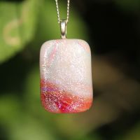 Pale pink and red rainbow dichroic glass pendant 