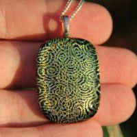 Double layer whorls dichroic glass pendant