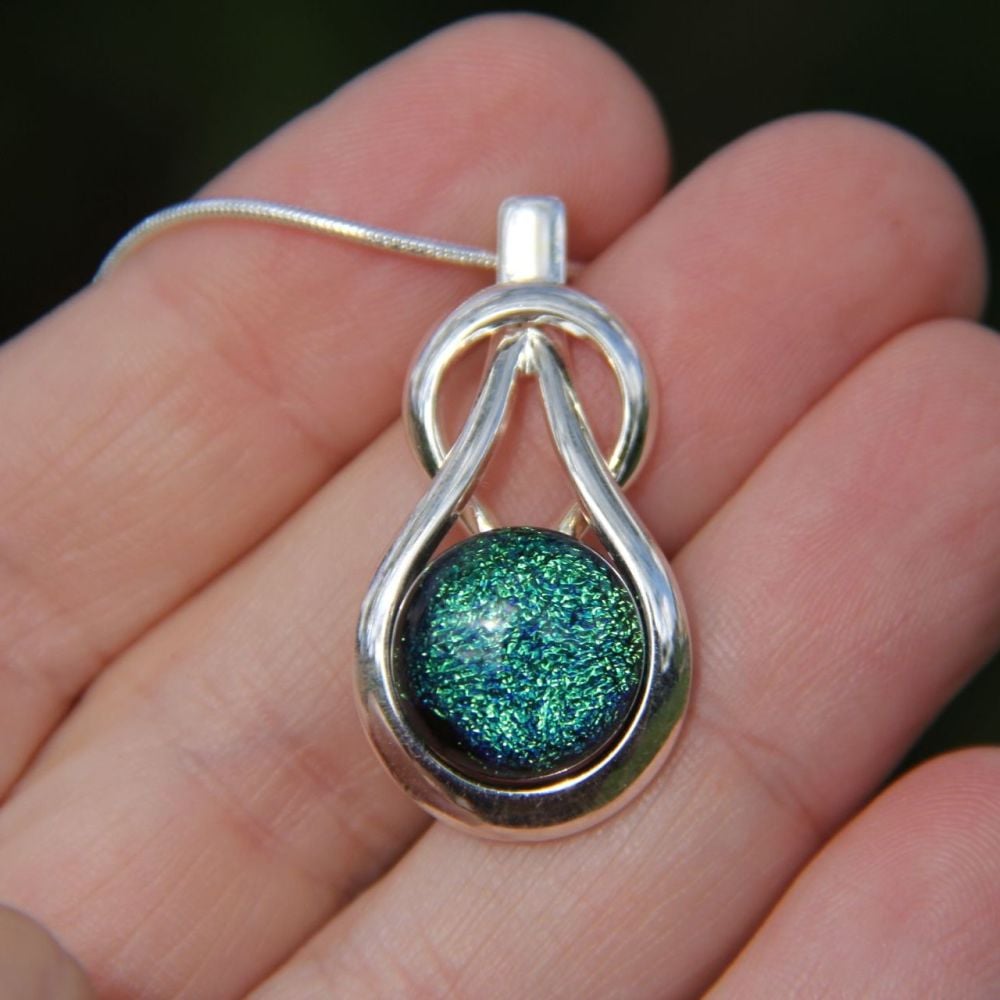 Green dichroic glass knot pendant 