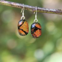 Orange and black dichroic drop earrings
