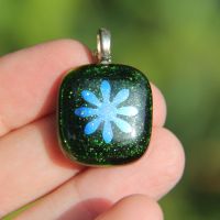 Green sparkly glass pendant with dichroic flower