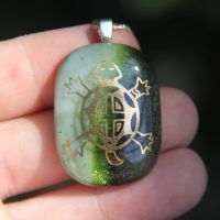Sparkly green and white glass turtle pendant
