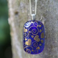 Blue and gold fused glass heart swirl pendant