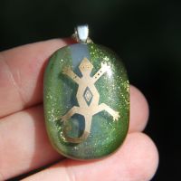 Sparkly green and white glass lizard pendant
