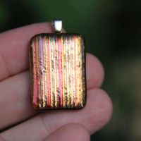 Orange and gold striped dichroic glass pendant
