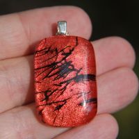 Bright red and black dichroic glass pendant