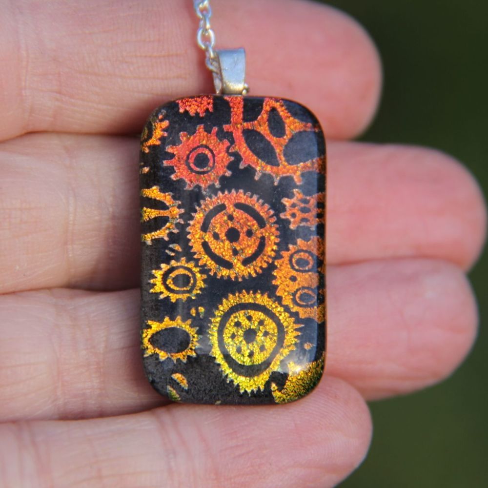 Orange gold Steampunk gears dichroic glass  pendant