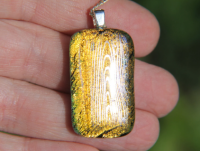 Silver and orange dichroic wood grain pendant