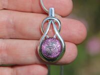 Pale pink dichroic knot pendant