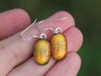 Bright orange dichroic glass dangly earrings