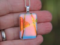 Orange dichroic streamer and confetti dichroic glass pendant