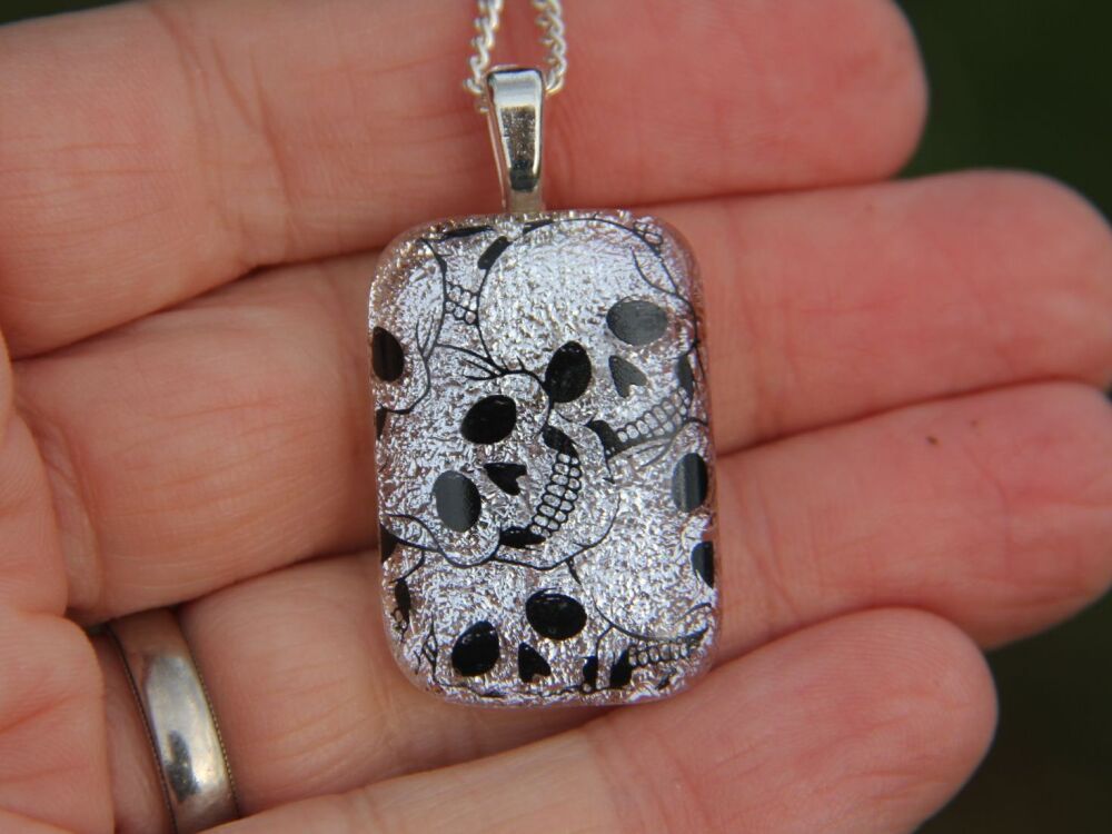 Silver skull dichroic glass pendant