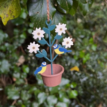 Pair of blue tits on a plant