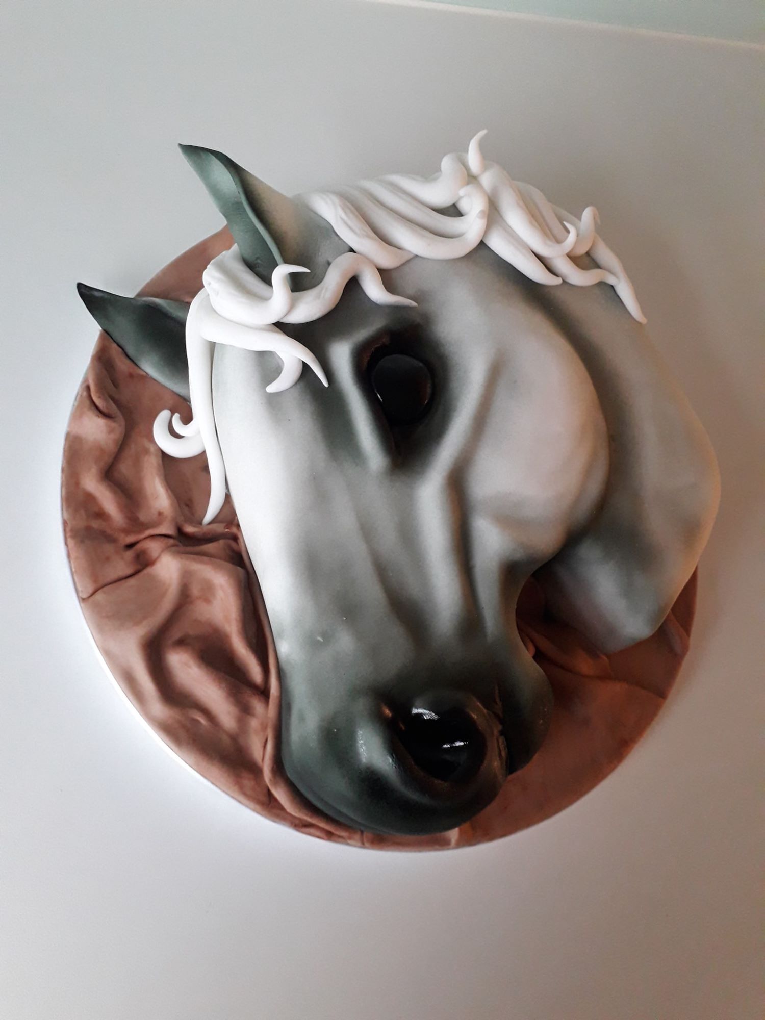 Grey horse head cake