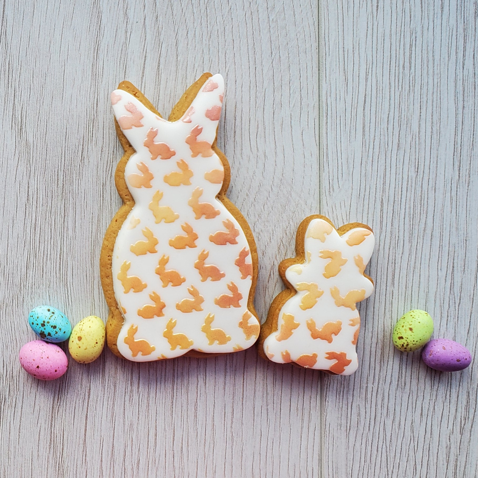 Little bunnies decorated onto two bunny shaped cookies