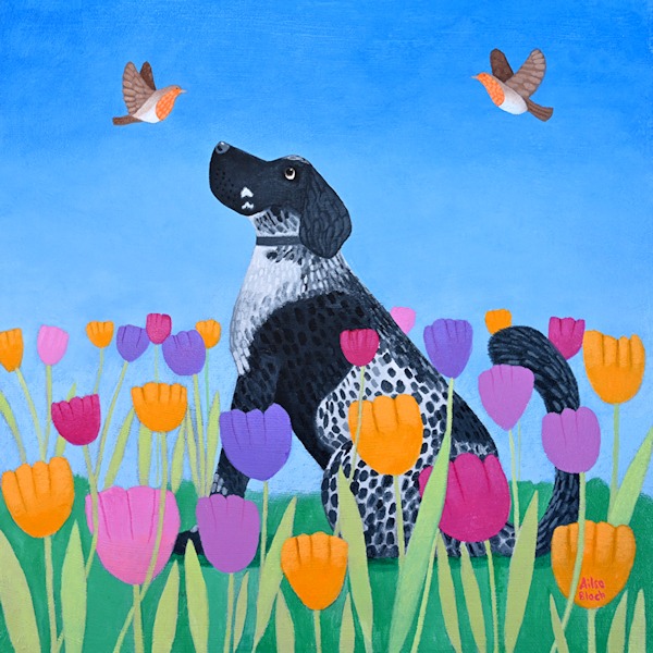 A cocker spaniel with robins in tulips