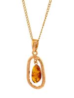 P107 - 237 Baltic Cognac Amber & gold plated silver hoop style pendant.