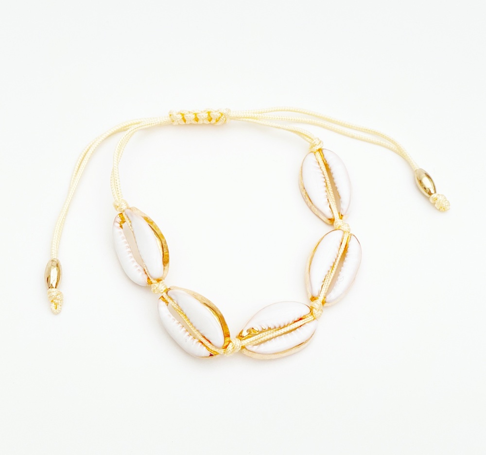 White and gold faux cowrie shell bracelet