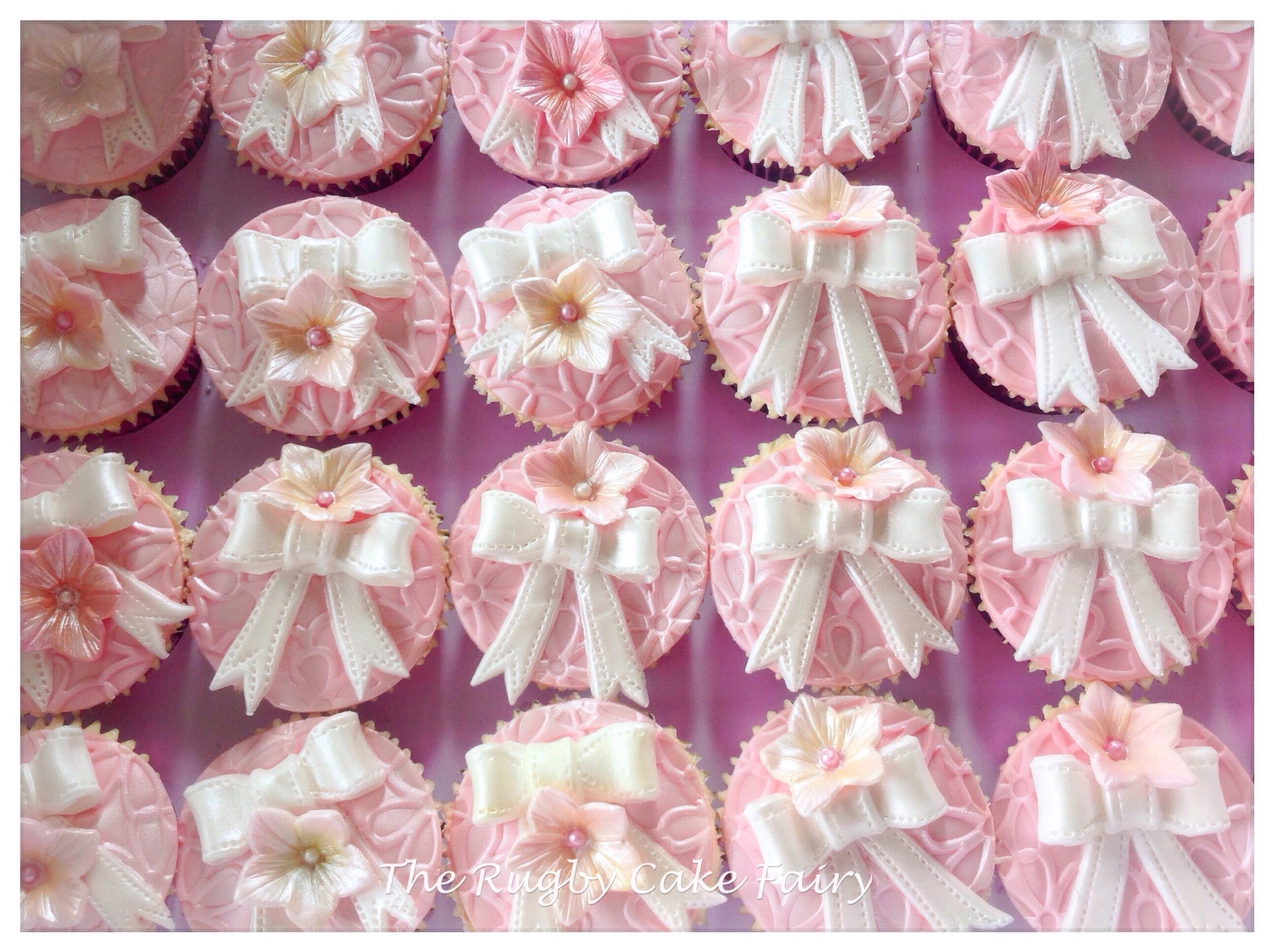 Pink bow cupcakes