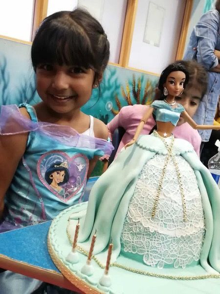 princess jasmine doll cake with girl