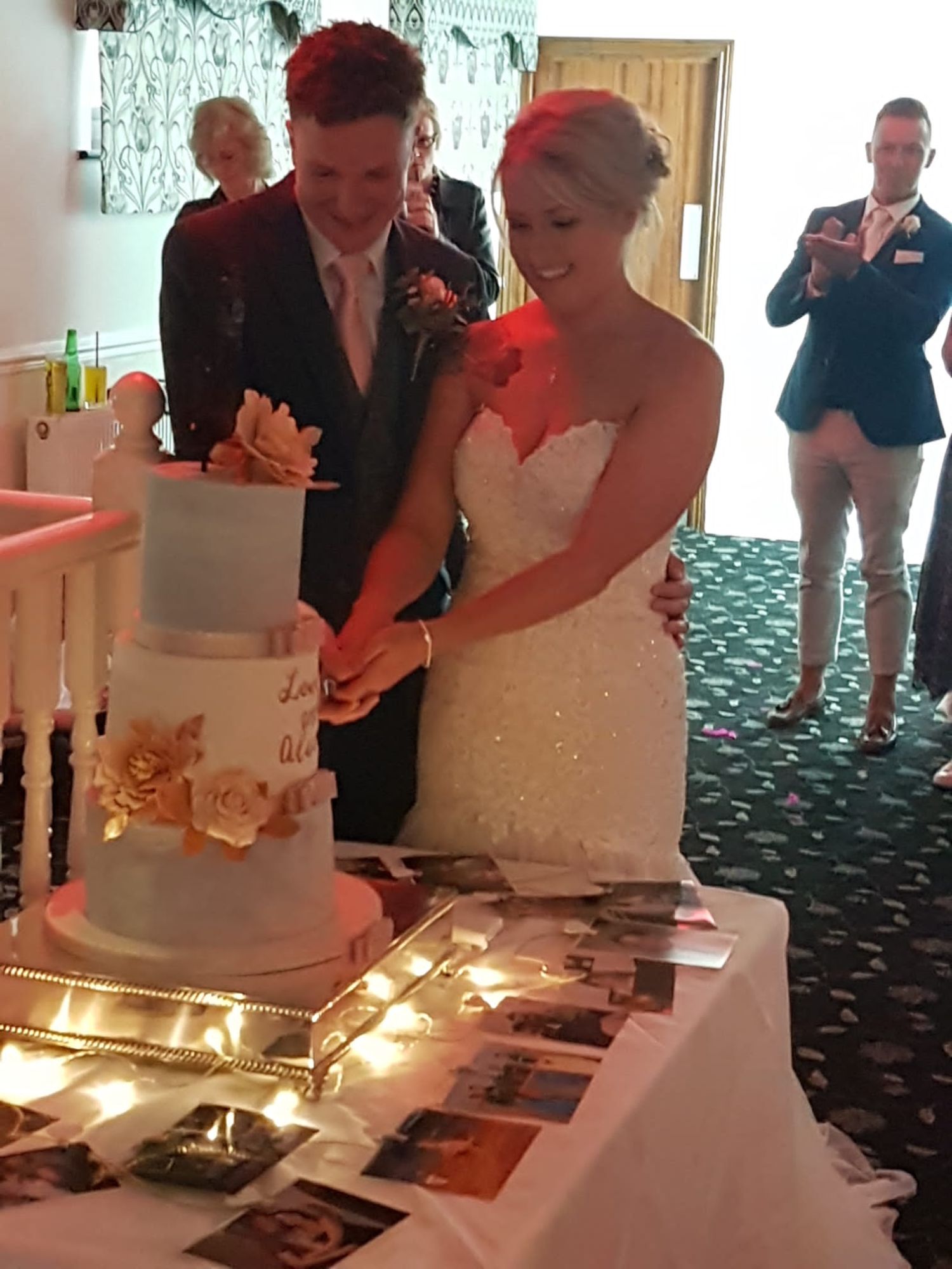 alice and lewis cutting wedding cake