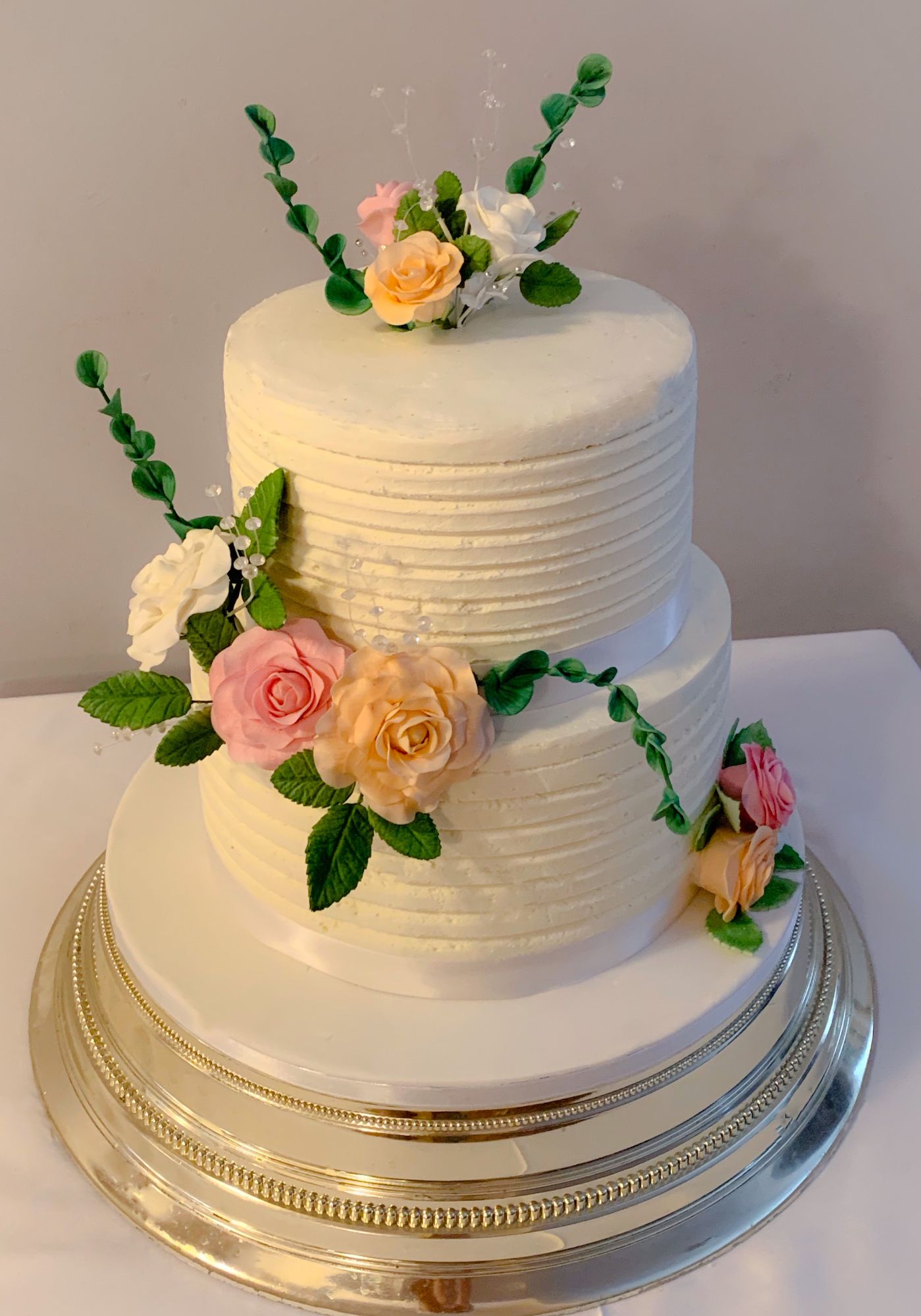buttercream and rose wedding cake 