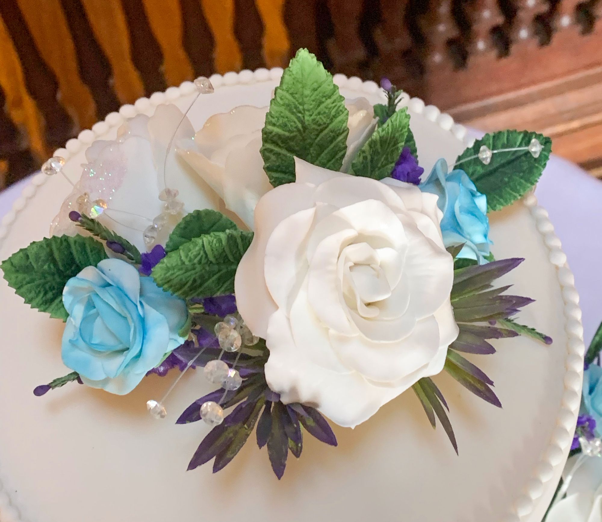 blue and white rose wedding cake topper