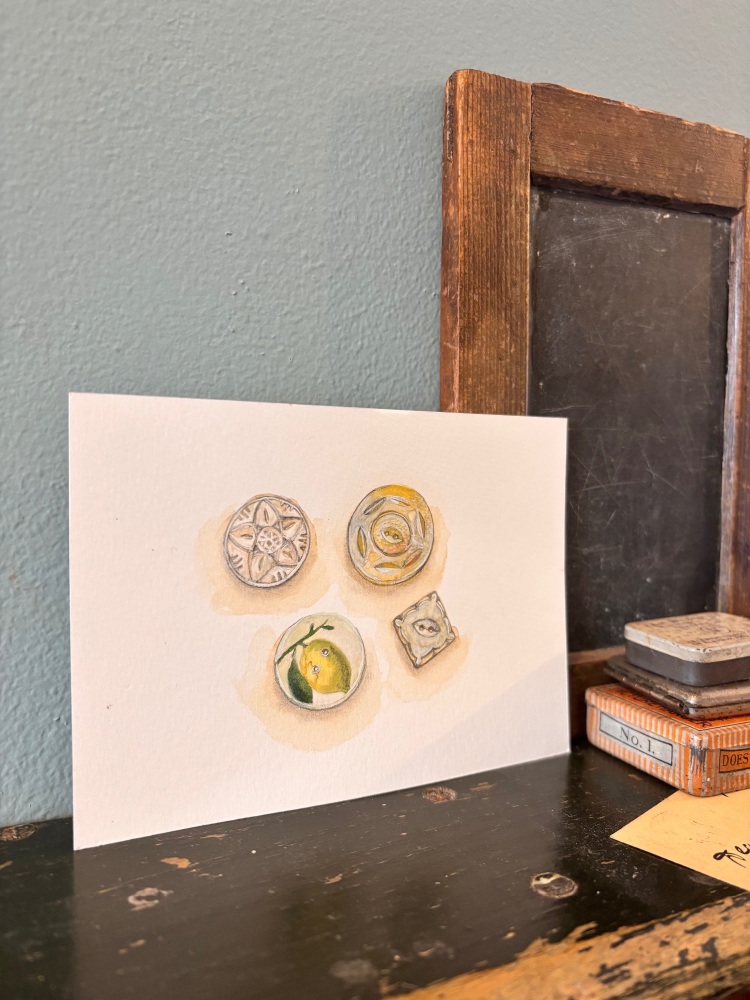 Four buttons; faceted glass, two mother of pearl + lemon