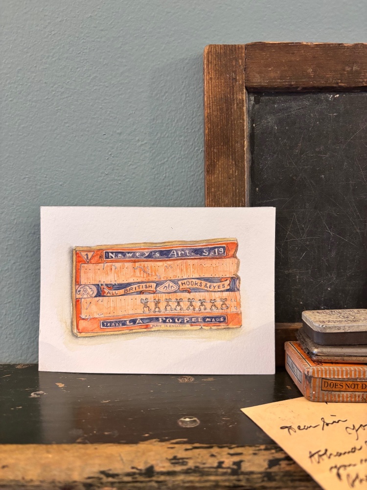Orange hook and eye card