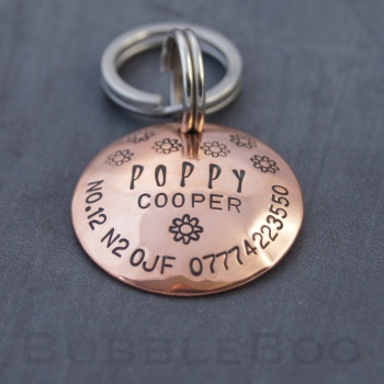 Pet Name Tag with Flowers. Handmade Personalised Domed Copper Pet Id Tag. Also available in aluminium.