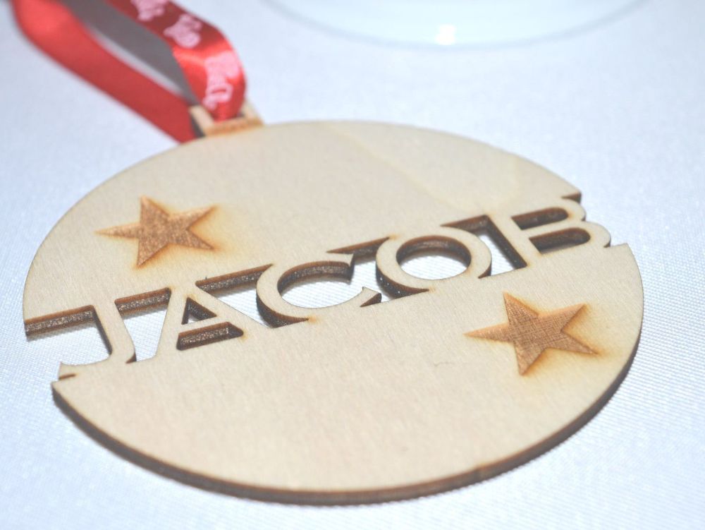 Personalised Wooden Christmas Bauble With A Star Design