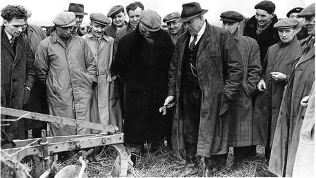 Men setting a plough