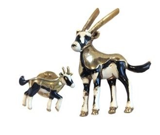 Vintage Cabouchon gold plated mother antelope brooch with a baby antelope Tac-pin in white and black enamel. Sold as a set.