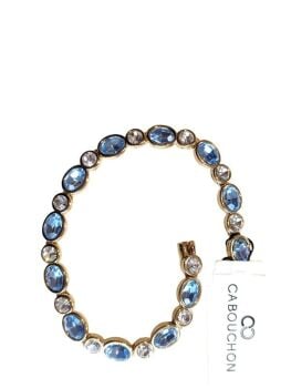 Vintage Cabouchon bracelet with gold plating, light blue stones and Austrian crystals. Size medium.