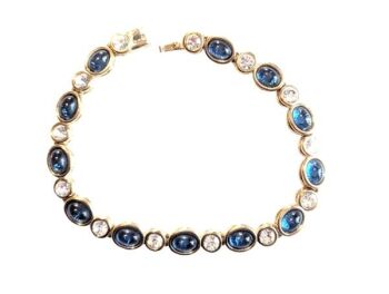 Vintage Cabouchon bracelet with gold plating, sapphire coloured blue stones and Austrian crystals. Size medium.