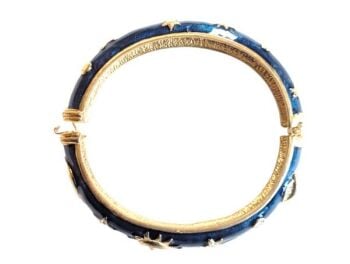 This is a beautiful vintage bangle from the Cabouchon Astrology collection. Size Medium.