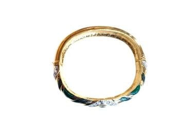 Beautiful statement vintage bangle from Cabouchon with green enamel and Austrian crystals. Size small.