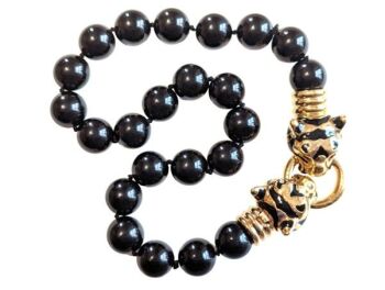 Vintage Cabouchon Tiger necklace with gold plating and black enamel and onyx coloured black round stones