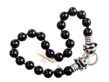 Vintage Cabouchon Tiger necklace with rhodium plating and black enamel and onyx coloured black round stones